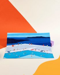 540-piece puzzle depicting a scenic coastal landscape with boats and islands in the distance against a vibrant orange and blue background.