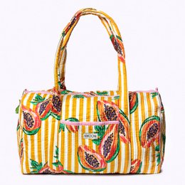  Handmade cotton bag with a vibrant papaya print in yellow and green stripes, perfect for weekend getaways.