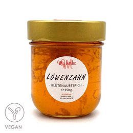 Dandelion flower spread, a vegan honey-like spread made from dandelion flowers. The product has a vibrant orange color and a thick, spreadable texture.