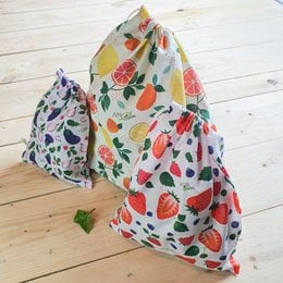 Reusable food wrap bags in a variety of tropical fruit and leaf patterns, suitable for bulk storage and food preservation.