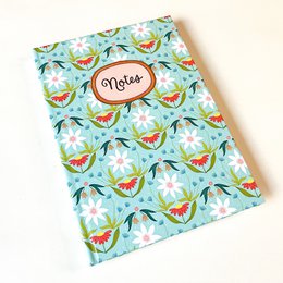  A5 notebook with an autumnal pumpkin pattern, available in blank or lined variants.
