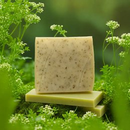 Vegan stinging nettle hair soap with nourishing ingredients for oily and sensitive scalp. Natural, handmade soap bar with green leaves.
