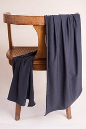 Deep charcoal modal jersey fabric, soft drape, dark gray textile material for dresses