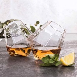 Set of 2 diamond-shaped whisky glasses with amber-colored liquid.