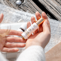 Calme Absolu AromaCare Perfume, an essential oil product with a sleek, minimalist design. The perfume bottle features a simple, rectangular shape with a white label and cap.