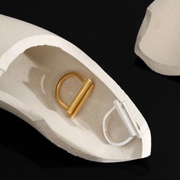 Geometric double bar ring in sterling silver and gold vermeil. Statement piece with a modern, minimalist design.