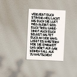 A white postcard with handwritten German text that appears to be a love letter or romantic message. The text is in a cursive style and fills the entire surface of the card.