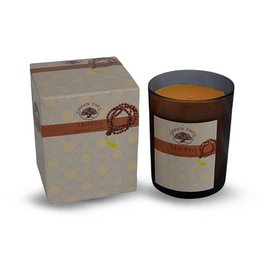 A tall, round, green-colored scented candle in a decorative box with a tree and mantra design.