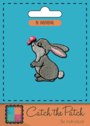 Gray rabbit brooch with butterfly design. Embroidered patch with detailed rabbit figure and colorful butterfly accent.