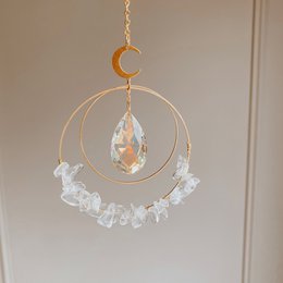  Elegant crystal sun pendant dreamcatcher with crescent moon and natural quartz crystals, promoting positivity and spiritual connection.