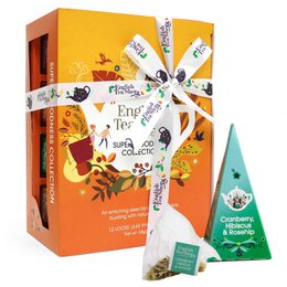 Organic tea gift set with 12 tea pyramids in an orange box with floral and nature-inspired designs.