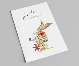 Easter card with a cute bunny holding an egg and a flower. The card has a handwritten "Joyeuses Pâques" text.
