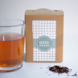  Assorted tea boxes with colorful patterns and text labels, including "Hurrah! Congratulations" and "Feel geluk".