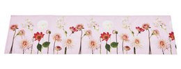  A floral table runner with a vibrant garden-inspired design featuring various colorful flowers against a light background.