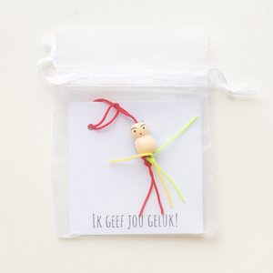 Card in bag gives good luck
