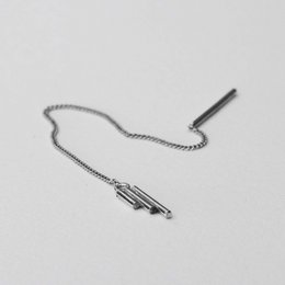 Statement earrings in 14k gold or sterling silver with a minimalist, modern design featuring a long, thin chain and a simple bar accent.