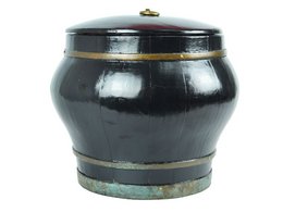 A black ceramic decorative bucket with a lid, featuring a rustic, earthy design with a wooden interior.