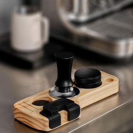  Wooden tamper station for portafilter, with black tamper and accessories, designed for coffee machines.