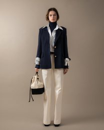  Relaxed fit plaid trousers in a neutral color palette, suitable for casual or smart-casual wear.