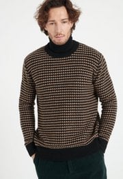 Men's black and beige houndstooth pattern sweater with a turtleneck collar.