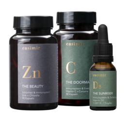 Immunity supplement set containing vitamin C, D3, and zinc in capsule form. The set includes a zinc supplement labeled "The Beauty" and a vitamin C supplement labeled "The Doomer".