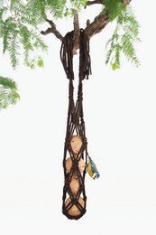  A hanging bird feeder made of dark brown woven material with a diamond pattern design, suspended from a tree branch.