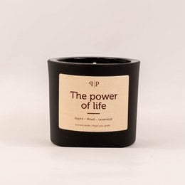 Gemstone scented candle with a round, tall shape, featuring a black container and a label that reads "The power of life". The candle contains various gemstones and natural elements, creating a unique and powerful scent.