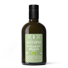 Premium organic extra virgin olive oil in a green glass bottle with a black cap. The label features the brand name "Guccione BIO" and indicates that the product is certified organic.