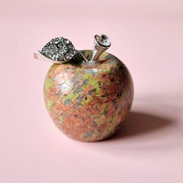  A small, decorative apple-shaped gemstone ornament made of unakite, a type of green and pink granite. The ornament is covered in rhinestones and has a metallic stem.