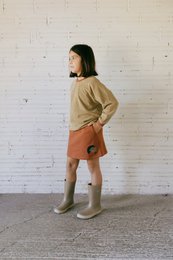 Short flared skirt in terracotta color, suitable for kids aged 2-10 years.