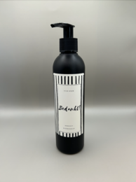 Black and white hand soap bottle with "Thank you" text. Cylindrical shape, black pump dispenser.