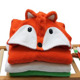 Soft, hooded orange bath poncho with fox ears and face design, perfect for kids' bath time.