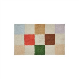  Small area rug with a geometric pattern of squares in various earth-toned colors including red, green, brown, and beige.
