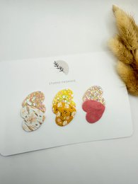  Set of anti-slip hair clips in spring-inspired colors and designs, including floral, polka dot, and heart-shaped clips.