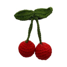 Handmade crochet hair tie with red cherry design, green leaves, round ball shape, cute fruit accessory.