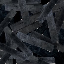 Bulk 100% French activated carbon water filter, black in color, rectangular shape.