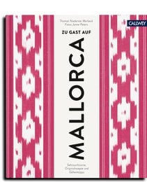 A vibrant, pink and white patterned book cover with the title "Mallorca" prominently displayed. The cover features a bold, geometric design reminiscent of traditional Balearic Island textiles, suggesting the book's focus on the island of Mallorca.