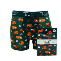 Boxer shorts with a camping-themed pattern featuring tents, campfires, and other outdoor elements in a variety of colors on a dark green background.