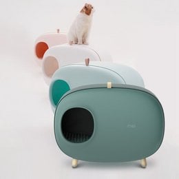 A modern, multi-colored cat litter box with a drawer for easy cleaning. Available in blue, green, mint green, pink, and white.