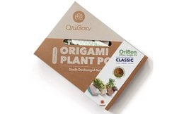 Origami plant pot kit with assorted decorative elements including pots, soil, and accessories for a classic plant display.