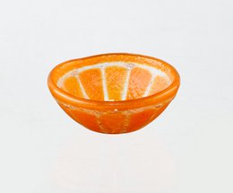  Small orange bowl with sliced orange segments.