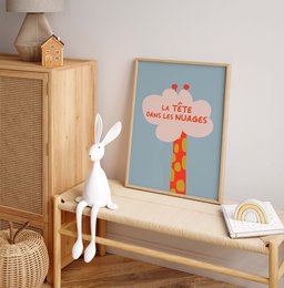 Whimsical wall art featuring a giraffe and a cloud with the text "La tête dans les nuages" (Head in the clouds). The artwork has a playful, colorful style that would complement a variety of home decor styles.