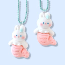 A cute and whimsical mermaid bunny necklace for kids, featuring a soft plush bunny figure with a pink mermaid tail and a beaded chain necklace in a pastel teal color.