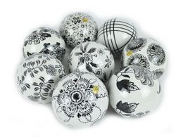 Decorative porcelain balls in various patterns and designs, including floral, abstract, and geometric motifs. These spherical ornaments can be used for home decor, centerpieces, or as unique accents.
