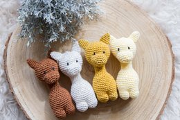 Soft, plush giraffe rattle in neutral colors including brown, white, yellow, and beige. Ideal for babies and toddlers.