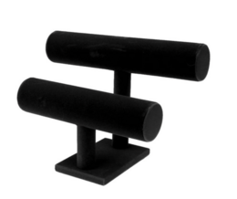 Black bracelet holder with two cylindrical stands for displaying and organizing bracelets.