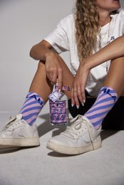 Jute bags, 3 pairs of socks, stickers, and postcards in a variety of colors and designs.