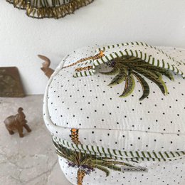  Large cosmetic bag with palm tree and striped pattern, suitable for makeup storage and organization.