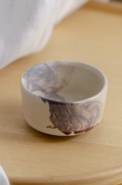 Handcrafted ceramic mug with a unique marble-like glaze in shades of gray and white. Suitable for hot and cold beverages.