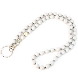 White beaded keychain with shark charm